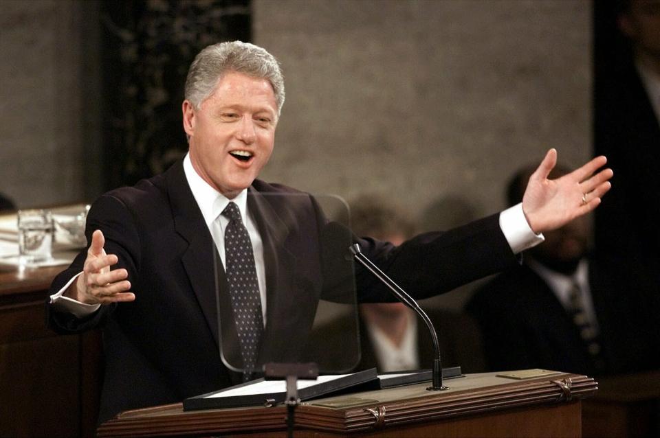 FILE - In this Jan. 19, 1999, file photo, President Bill Clinton gestures while giving his State of the Union address on Capitol Hill in Washington. President Donald Trump will deliver his State of the Union address at one of the most contentious times in his stewardship of the nation, but others may have had it worse: Abraham Lincoln had the Civil War, Richard Nixon was caught up in Watergate and Clinton was impeached. (AP Photo/J.Scott Applewhite, File)