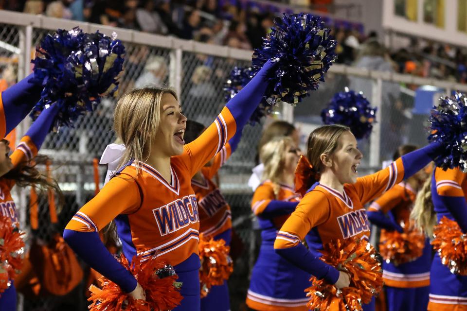 The Delmar cheerleaders perform a cheer during Caravel’s 24-14 win over the Wildcats at Francis E. Nunvar Stadium.