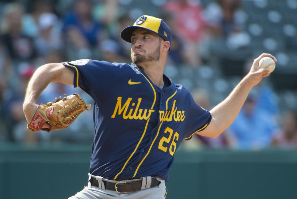 Milwaukee Brewers relief pitcher Aaron Ashby delivers the final pitch, striking out Cleveland Indians' Franmil Reyes, during the ninth inning of a baseball game in Cleveland, Sunday, Sept. 12, 2021. (AP Photo/Phil Long)