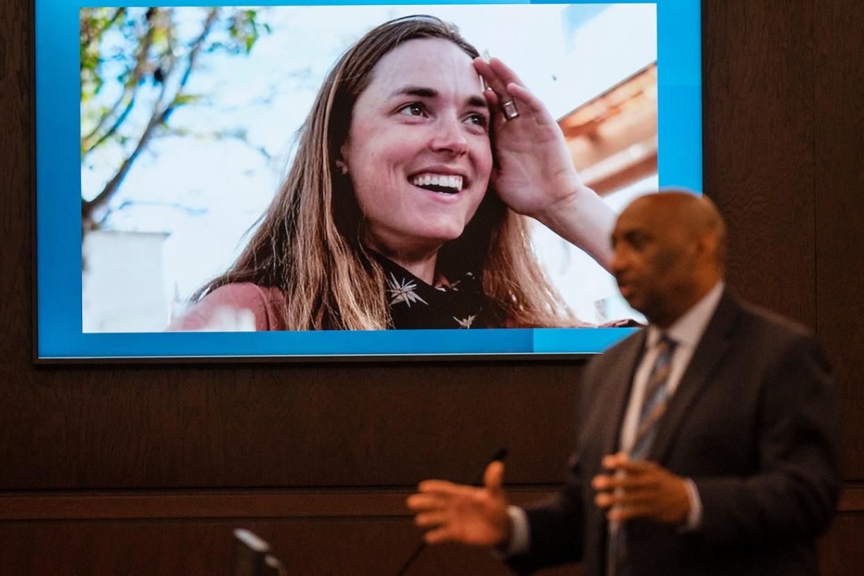 Anna "Mo" Wilson's photo is displayed on a courtroom screen as prosecutor Rickey Jones addresses the jury during Friday's sentencing portion of Kaitlin Armstrong's trial.