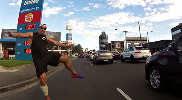 Footage has surfaced of a cyclist appearing to be set upon by a raging pedestrian as he rides down a Melbourne highway. Picture: Sean H/YouTube