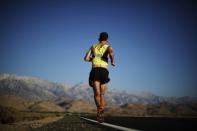 Carlos Alberto Gomes De Sa of Portugal runs on his way to winning the Badwater Ultramarathon from the foot of Mount Whitney, California in this July 16, 2013 file photo. An ultramarathon involves a combination of running and walking further than the traditional marathon of 26.2 miles (42.2 kilometres). Though most ultras cover distances of either 50 or 100 miles, many are much longer. For the ultramarathoner, it is all about running for joy, setting personal goals and trying to overcome every obstacle faced. To match ATHLETICS-ULTRAMARATHONS/ REUTERS/Lucy Nicholson/Files (UNITED STATES - Tags: SPORT ATHLETICS)