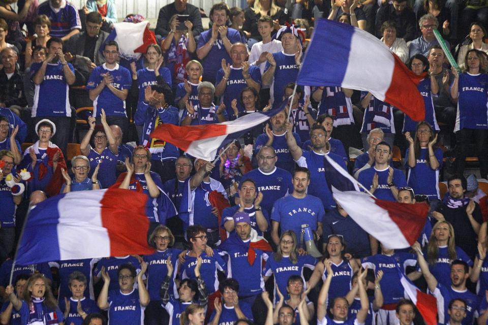 French supporters encourage their team, during the double match between French players Michael Llodra, Julien Benneteau, and German pair Andre Begemann, Tobias Kamke, in the quarterfinals of the Davis Cup between France and Germany, in Nancy, eastern France, Saturday April 5, 2014.(AP Photo/Remy de la Mauviniere)