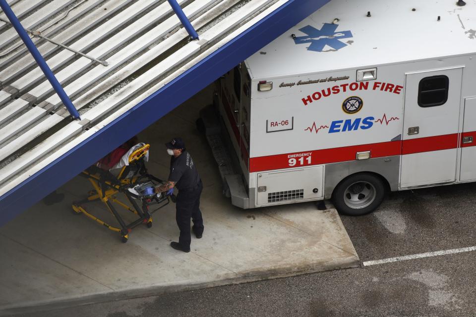 FILE PHOTO: A patient is wheeled into Houston Methodist Hospital as storm clouds gather over the Texas Medical Center, amid the global outbreak of the coronavirus disease (COVID-19), in Houston, Texas, U.S., June 22, 2020.  REUTERS/Callaghan O'Hare/File Photo