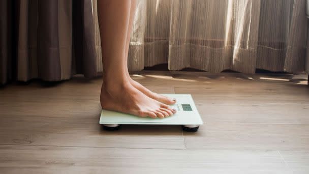 STOCK PHOTO: A woman on a weighing scale (STOCK PHOTO/Getty Images)