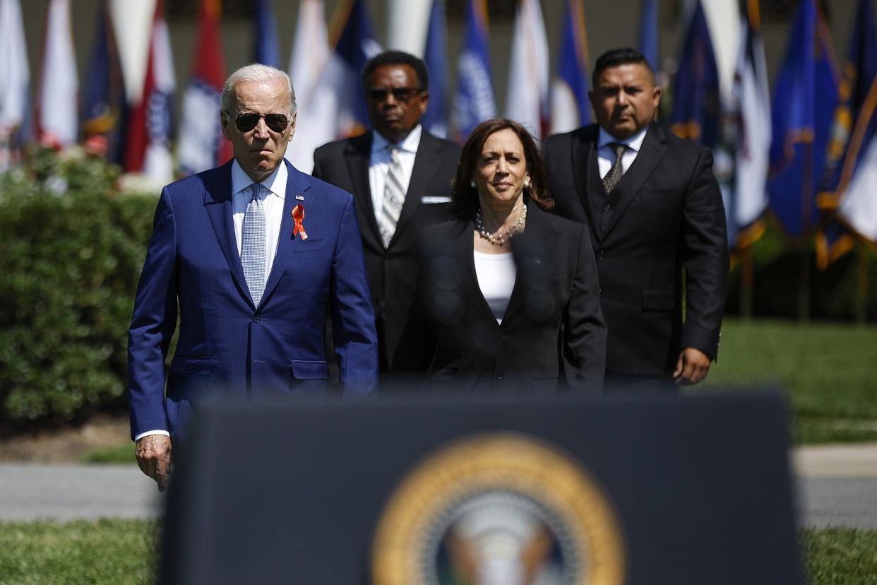 (L-R) U.S. President Joe Biden, Garnell Whitfield Jr., Vice President Kamala Harris and Dr. Dr. Roy Guerrero arrive for an event to celebrate the Bipartisan Safer Communities Act on the South Lawn of the White House on July 11, 2022, in Washington, DC. Calling the new law "the most significant gun violence reduction legislation in the last 30 years," the White House invited lawmakers, gun violence victims and other supports to the White House to commemorate its passage.