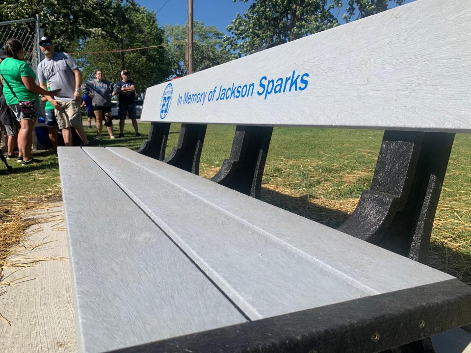 The Mukwonago Lions Club dedicated this bench as a memorial to Jackson Sparks, the 8-year-old Mukwonago boy who was killed in the Waukesha Christmas Parade tragedy in November 2021. The bench, unveiled on June 16, sits alongside the Field Park baseball diamond in the village.