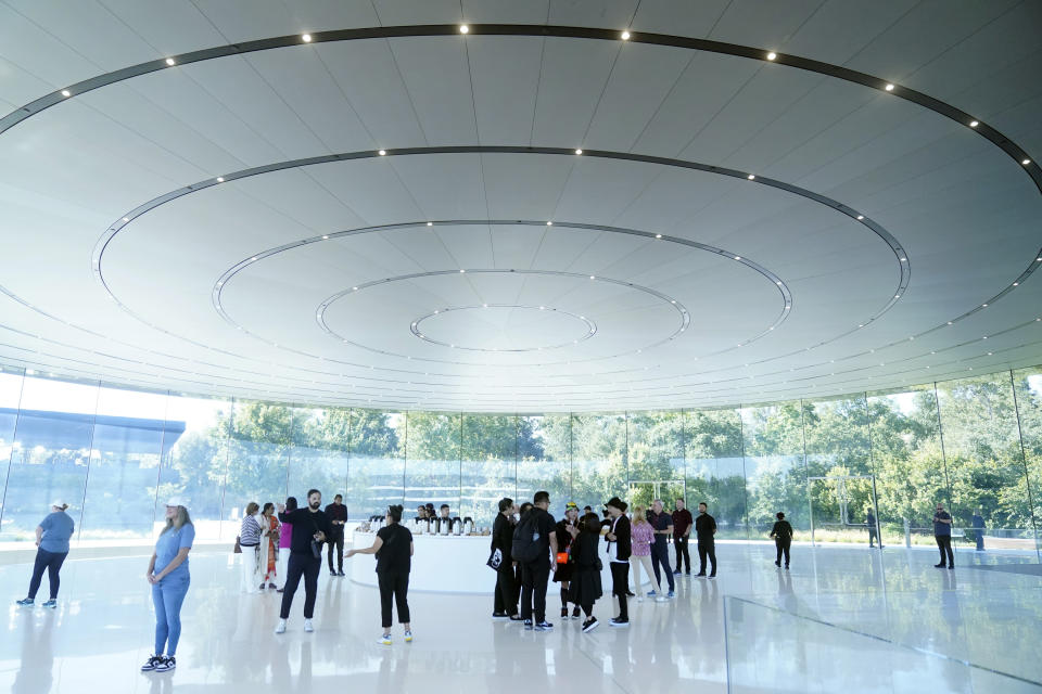 People wait inside the Steve Jobs Theater on the Apple campus before an announcement of new products Tuesday, Sept. 12, 2023, in Cupertino, Calif. (AP Photo/Jeff Chiu)