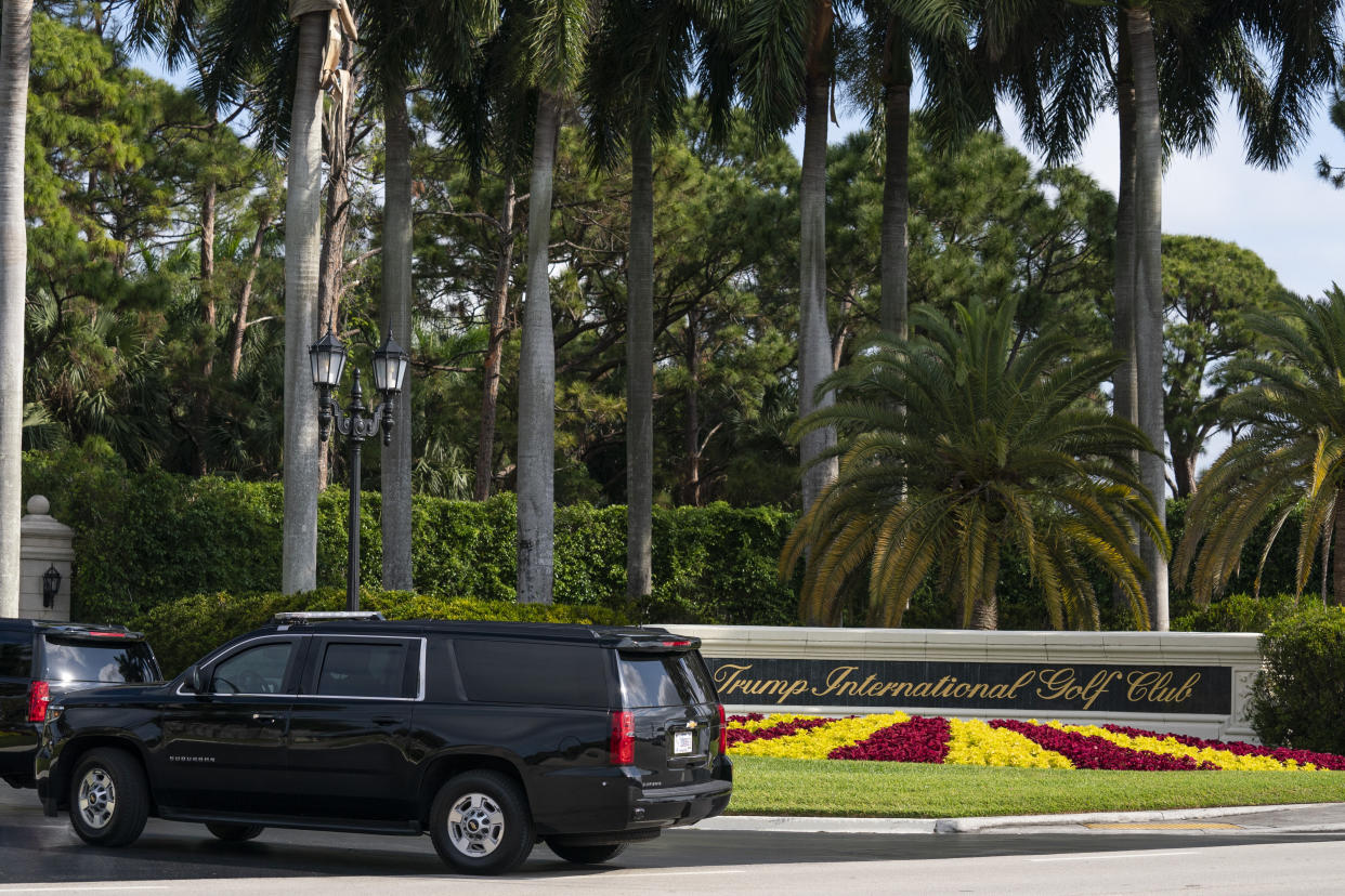 A motorcade carrying former President Donald Trump arrives at Trump International Golf Club, Sunday, April 2, 2023, in West Palm Beach, Fla. (AP Photo/Evan Vucci)