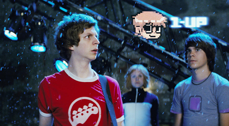 Michael Cera, Alison Pill, and Johnny Simmons looking at a floating cartoon head