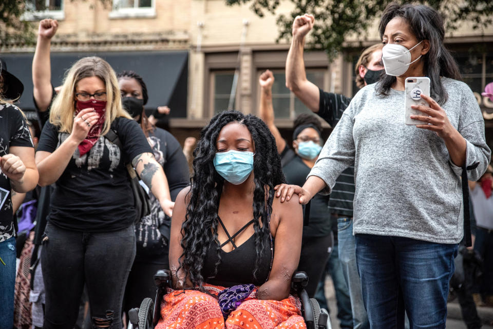 Whitney Mitchell, Garrett Foster's fiancée, attends a vigil for Foster on July 26, 2020 in downtown Austin, Texas.  (Sergio Flores / Getty Images file)