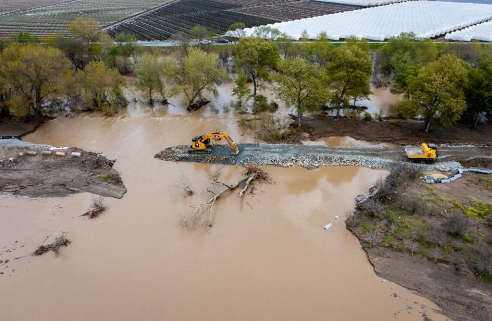 A breached levee being repaired on the Pajaro River in Monterey county on 14 March.