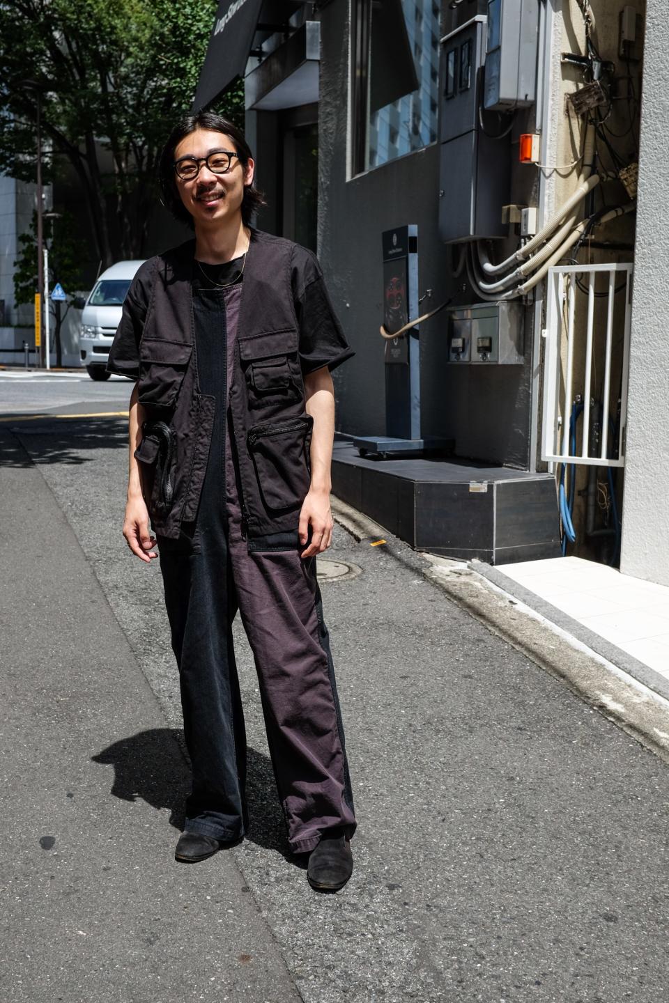 “This guy and his buddy were doing a photoshoot in the alley. The perfectly half two-tone velvet bib overall thing, with the vest on top? Come on.”