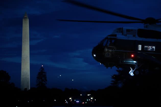 President Joe Biden is seen with staff in Marine One as it lands on the South Lawn of the White House on Oct. 7. (Photo: RENDAN SMIALOWSKI/AFP via Getty Images)