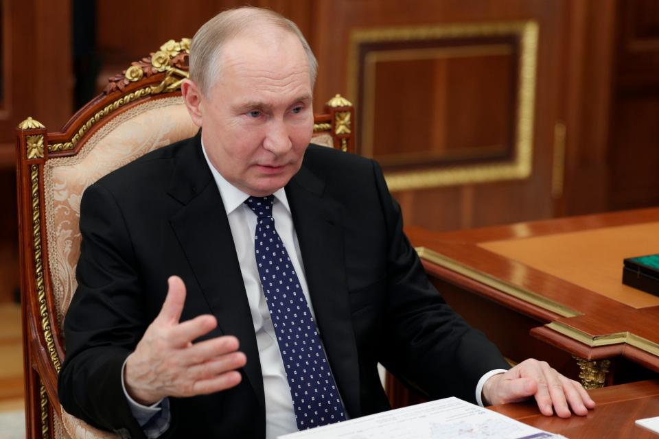 Russian President Vladimir Putin gestures as he speaks to Moscow Region Governor Andrei Vorobyov at the Kremlin in Moscow (AP)