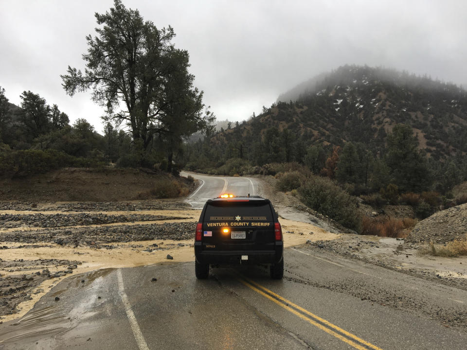 This Thursday, Jan. 17, 2019 photo provided by the Ventura County Sheriff's Dept. shows a flooded out crossing of Reyes Creek in Lockwood Valley in Ventura County, Calif. Californians were cleaning up and drying off Friday after a series of storms dumped heavy rain and snow throughout the state, caused at least six deaths and forced the rescue of more than a dozen people in rushing rivers. (Ventura County Sheriff's Dept. via AP)