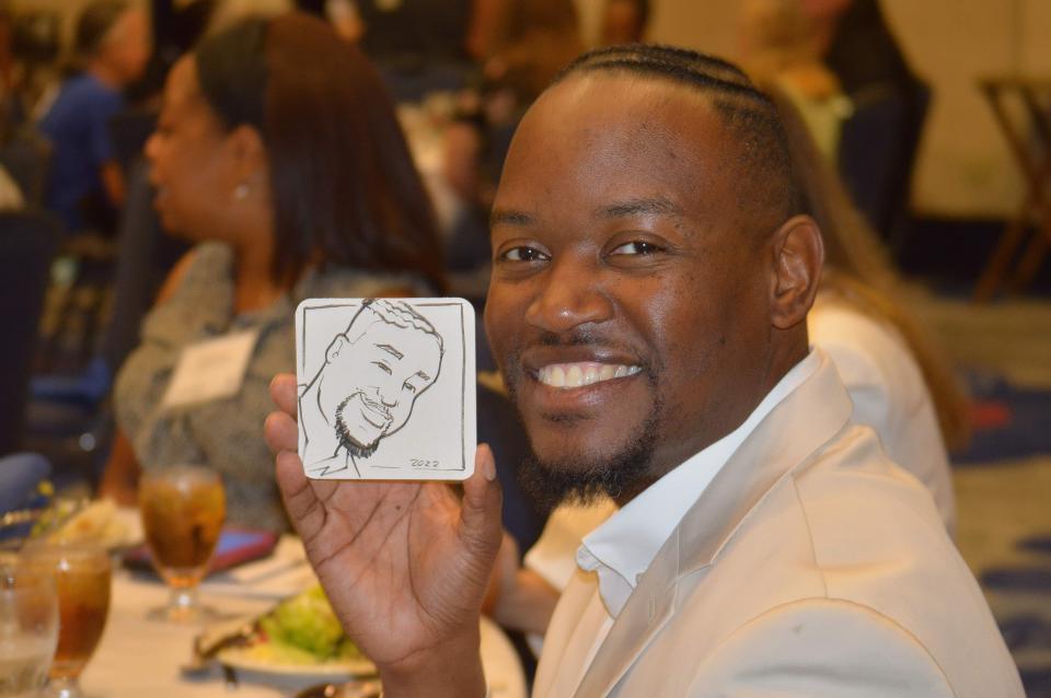 Goodwill Industries of Central Florida reception honors over 200 employees with guest speakers and a caricature artist.