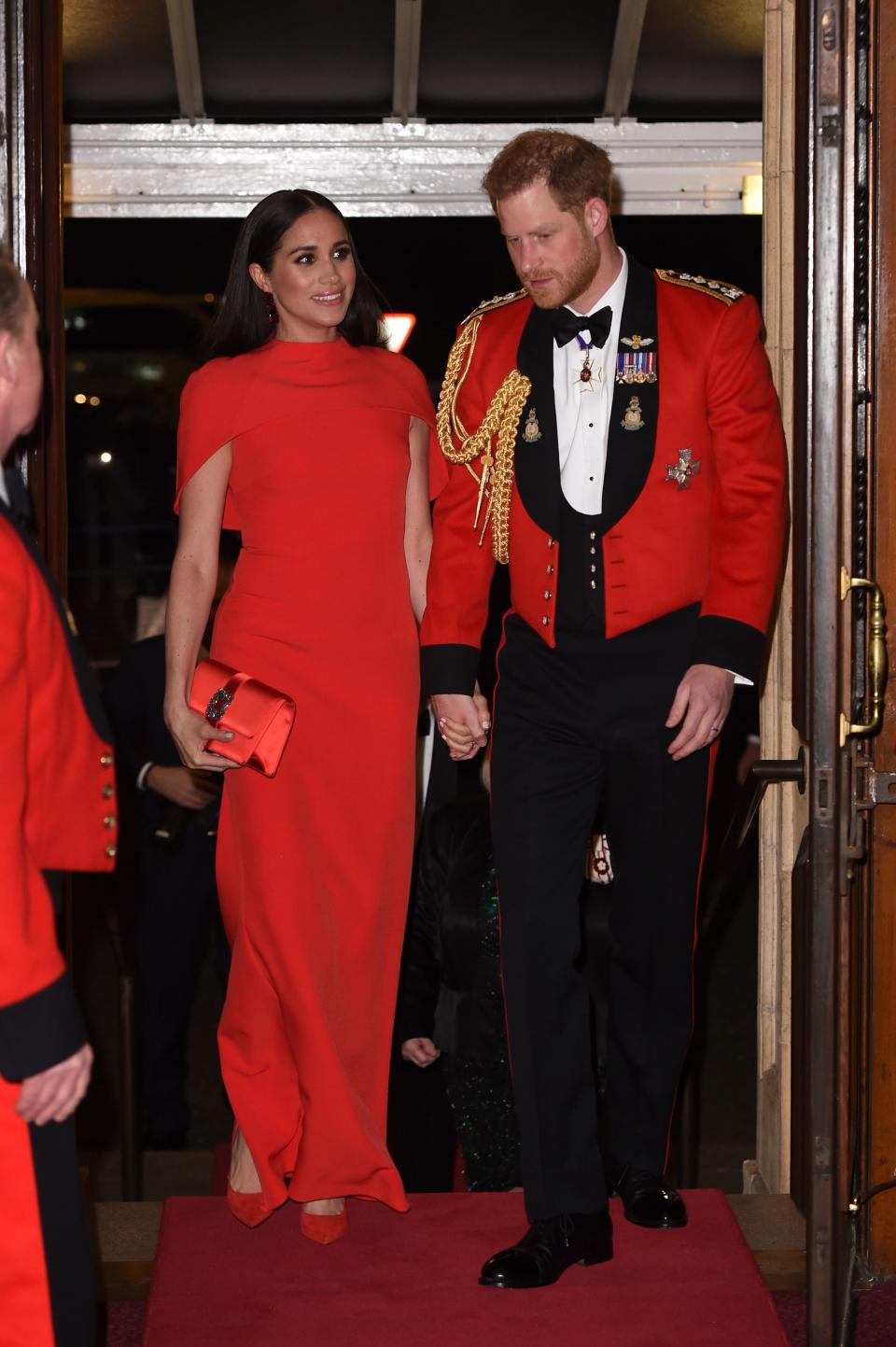 Britain's Prince Harry, Duke of Sussex and Meghan, Duchess of Sussex arrive to attend The Mountbatten Festival of Music at the Royal Albert Hall in London on March 7, 2020. - The Festival brings together world-class musicians, composers and conductors of the Massed Bands of Her Majestys Royal Marines. This year, the performance will mark the 75th anniversary of the end of the Second World War and the 80th anniversary of the formation of Britains Commandos. (Photo by Eddie MULHOLLAND / POOL / AFP) (Photo by EDDIE MULHOLLAND/POOL/AFP via Getty Images)