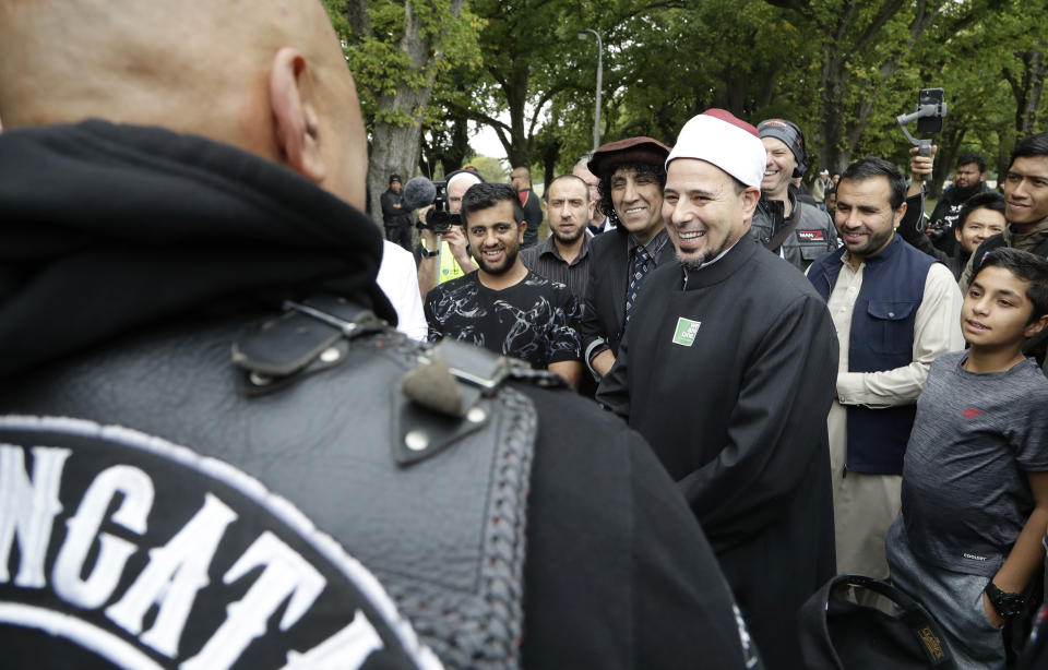 Imam of the Al Noor mosque Gamal Fouda smiles as he welcomes members of the Tu Tangata motorcycle club to the mosque in Christchurch, New Zealand, Sunday, March 15, 2020. A national memorial in New Zealand to commemorate the 51 people who were killed when a gunman attacked two mosques one year ago has been canceled due to fears over the new coronavirus. (AP Photo/Mark Baker)