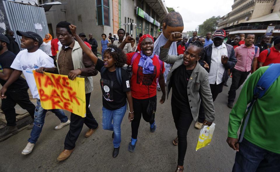 Protesters march against government corruption, on the 53rd anniversary of Kenya's independence, in downtown Nairobi, Kenya Monday, Dec. 12, 2016. Kenya's president on Monday criticized the International Criminal Court as "not impartial," saying his government "will give serious thought" to its membership of the court. (AP Photo/Ben Curtis)