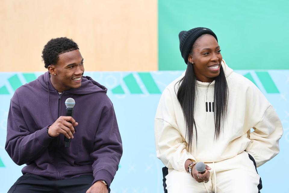 las vegas, nevada february 09 l r garrett wilson and chelsea gray speak in a huddle on the field as adidas debuts its brand campaign with a star studded roster of athletes at resorts world las vegas on february 09, 2024 in las vegas, nevada photo by joe scarnicigetty images for adidas