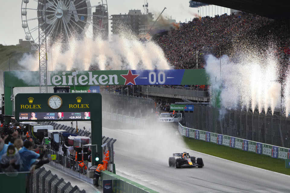 Fireworks go off as Red Bull driver Max Verstappen of the Netherlands wins the Formula One Dutch Grand Prix auto race, at the Zandvoort racetrack, in Zandvoort, Netherlands, Sunday, Aug. 27, 2023. (AP Photo/Peter Dejong)