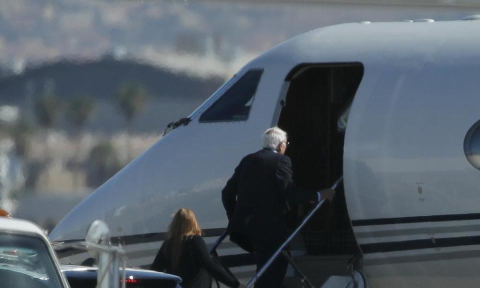 Senator Bernie Sanders boards a plane in Las Vegas on his way back home to Vermont