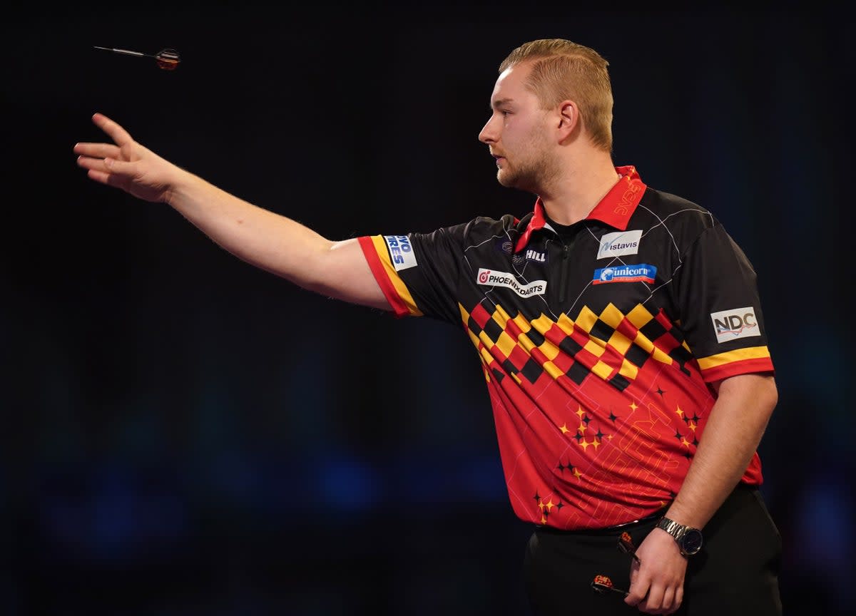 Dimitri Van Den Bergh knocked out reigning champion Peter Wright to win a classic at the World Matchplay in Blackpool (Adam Davy/PA) (PA Archive)