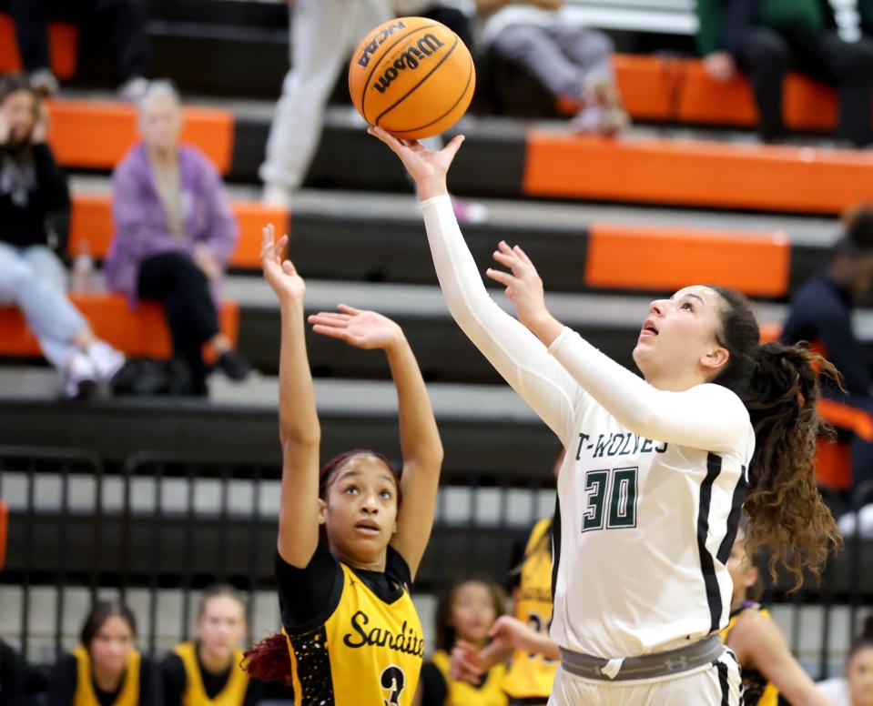 Norman North's Seleh Harmon shoots as Sand Springs' Yonnie Morris defends during the Putnam City Invitational high school basketball tournament at Putnam City high school in Oklahoma City, Thursday, Jan. 4, 2024.