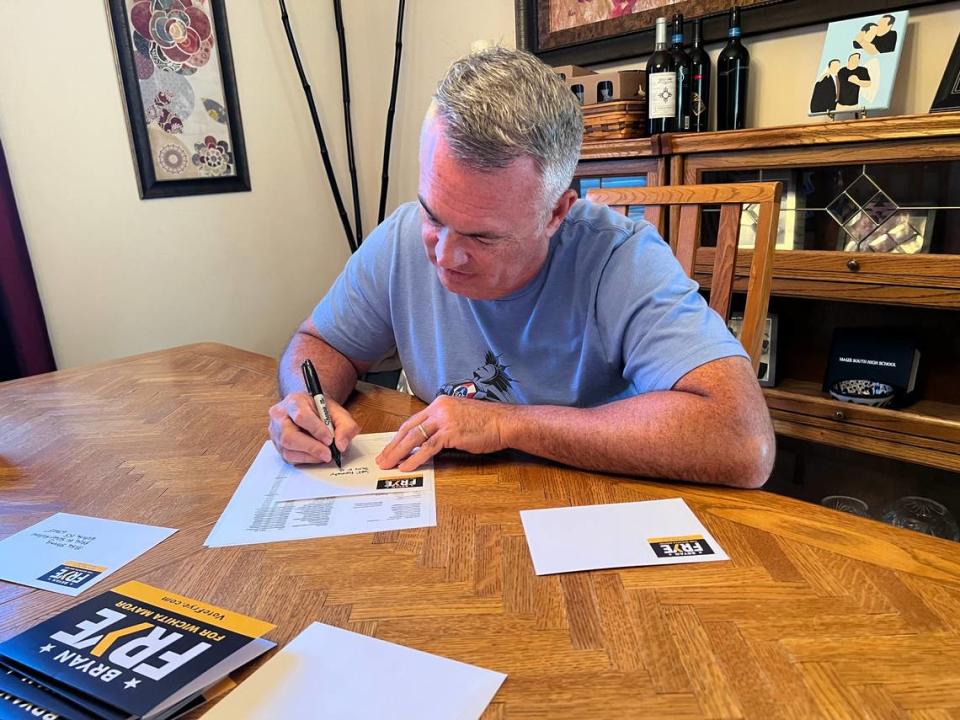 City Council member and mayoral candidate Bryan Frye spent part of election night writing campaign thank you notes — and keeping an eye on vote totals. “I’m definitely nervous. I think that you have to be humble and know that you’ve worked as hard as you possibly can and know that that’s good enough.” Carrie Rengers/Wichita Eagle