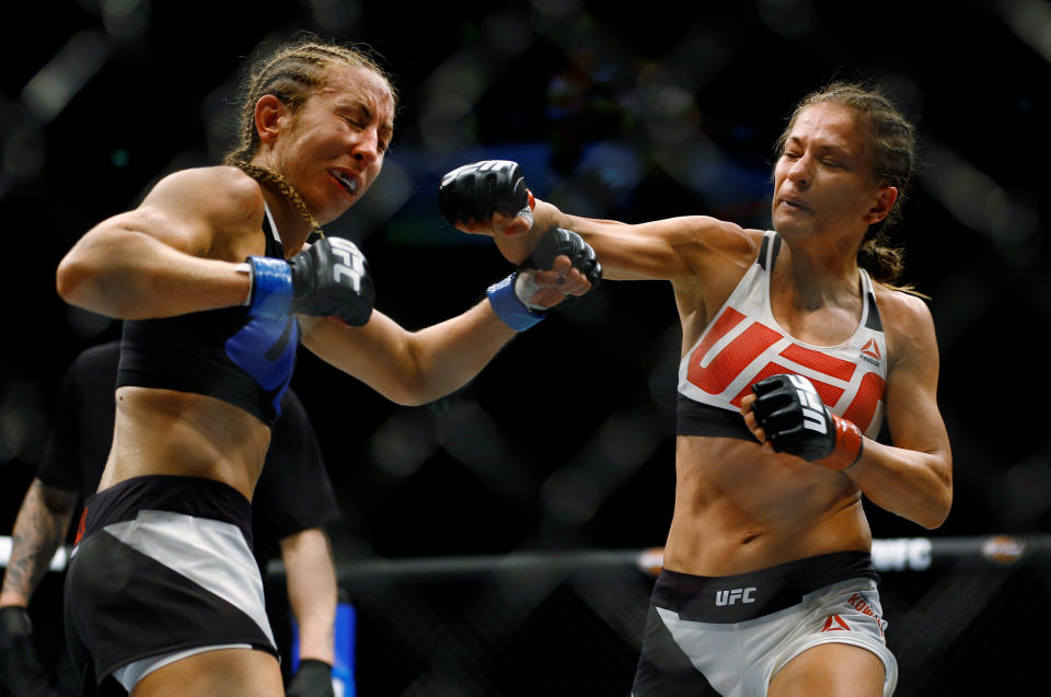 Mixed Martial Arts - UFC Fight Night - Karolina Kowalkiewicz v Heather Jo Clark - 8/5/16 - Karolina Kowalkiewicz (R) punches Heather Jo Clark. REUTERS/Michael Kooren