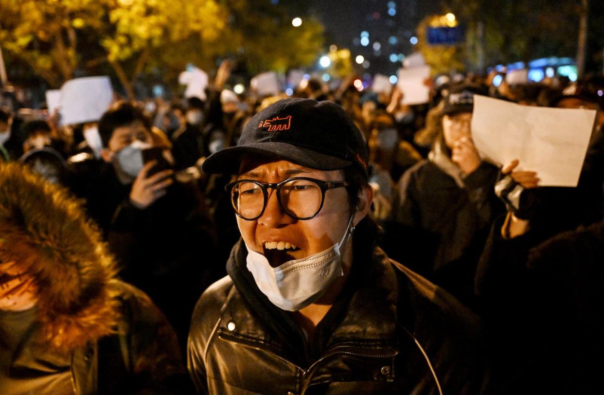 Protesters march along a street in Beijing on Nov. 28, 2022. <a href="https://www.gettyimages.com/detail/news-photo/protesters-march-along-a-street-during-a-rally-for-the-news-photo/1245152808?phrase=china%20protest%20noel%20celis&adppopup=true" rel="nofollow noopener" target="_blank" data-ylk="slk:Noel Celis/AFP via Getty Images;elm:context_link;itc:0;sec:content-canvas" class="link ">Noel Celis/AFP via Getty Images</a>