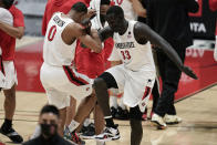 San Diego State forward Keshad Johnson (0) and forward Aguek Arop (33) celebrate after a 62-58 win over Boise State in an NCAA college basketball game Saturday, Feb 27, 2021, in San Diego. (AP Photo/Gregory Bull)