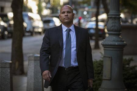 George Perez, a computer programmer for Bernard L. Madoff Investment Securities LLC, arrives at the Manhattan Federal Court house in New York, October 8, 2013. REUTERS/Brendan McDermid