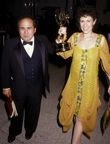 <p>Ron Galella, Ltd./Ron Galella Collection via Getty</p> Danny DeVito and his wife, Rhea Perlman, at the Emmys in 1984