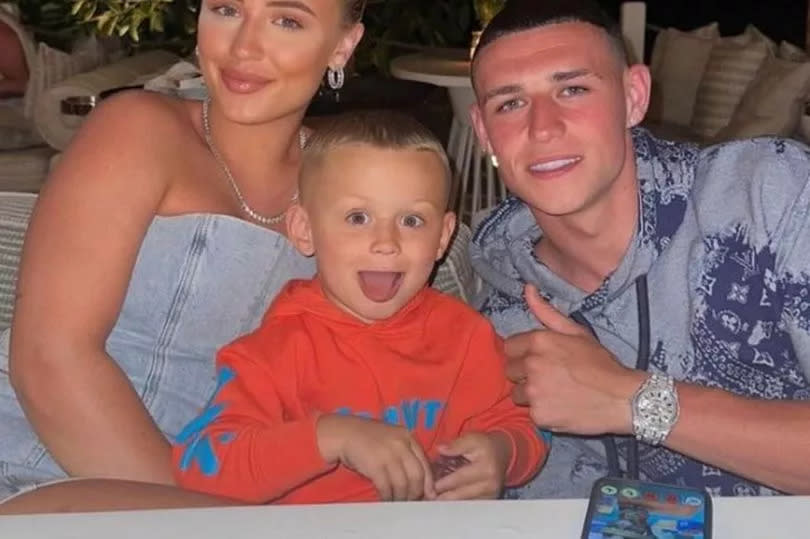 Phil Foden with his girlfriend and son