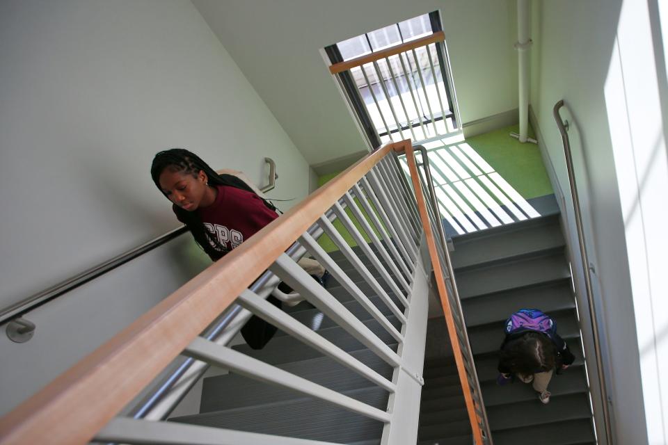 Students walk between floors of the Joan & Irwin Jacobs Center for Steam Education at Global Learning Charter Public School in New Bedford.