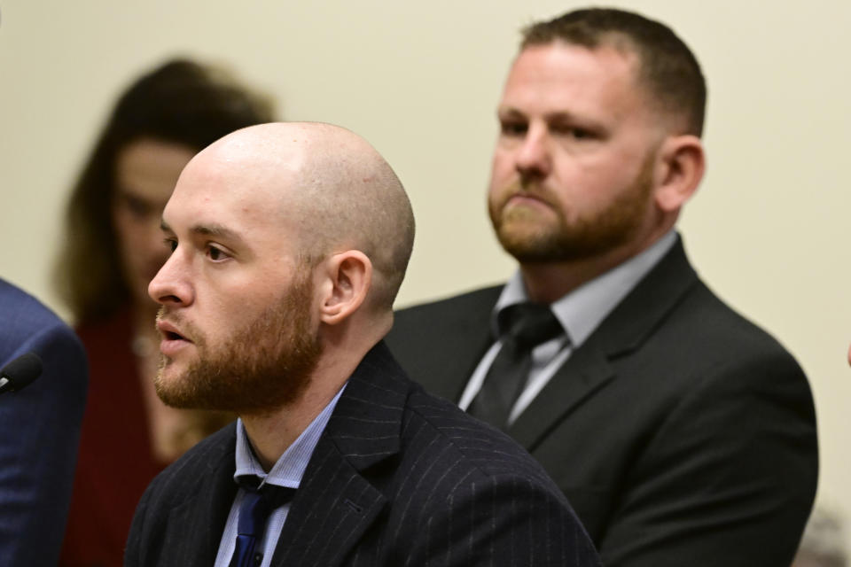 FILE - Former officer Jason Rosenblatt, left, and Aurora Police Officer Randy Roedema, right, attend an arraignment at the Adams County Justice Center in Brighton, Colo., Jan. 20, 2023. A judge in Colorado has agreed to delay the first criminal trial in the death of Elijah McClain, a 23-year-old Black man who was stopped by police, forcibly restrained and injected with a powerful sedative nearly four years ago. Police officers Roedema and Rosenblatt had been scheduled to go on trial starting July 10, but their lawyers asked for more time. (Andy Cross/The Denver Post via AP,File)