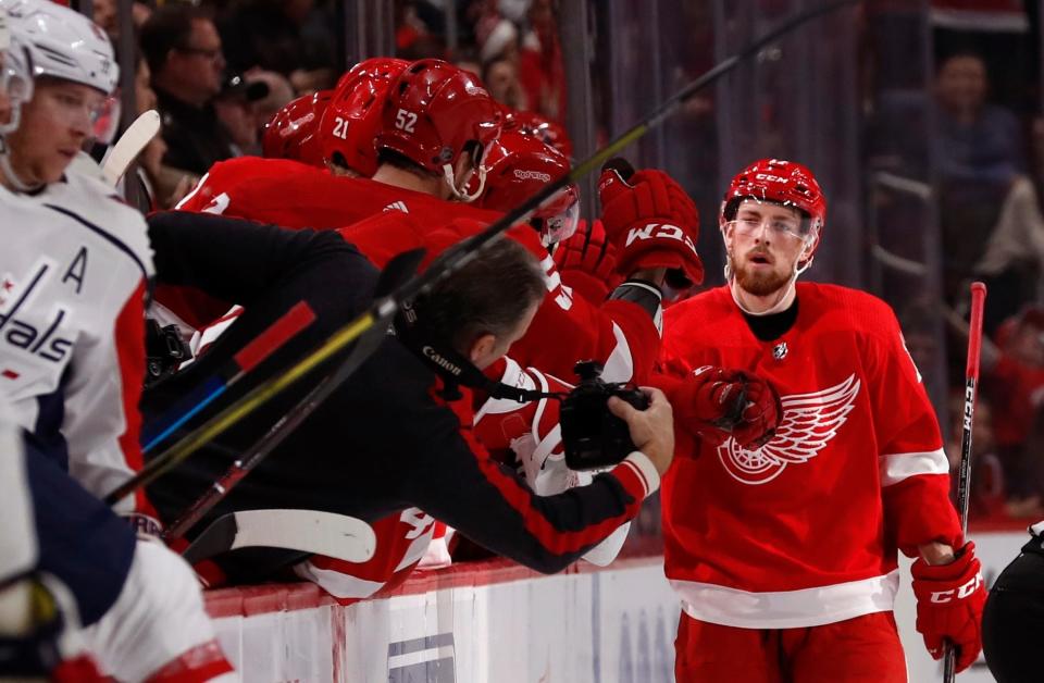 Detroit Red Wings defenseman Filip Hronek is congratulated by teammates after scoring in the second period against the Washington Capitals, Sunday, Jan. 6, 2019, in Detroit.