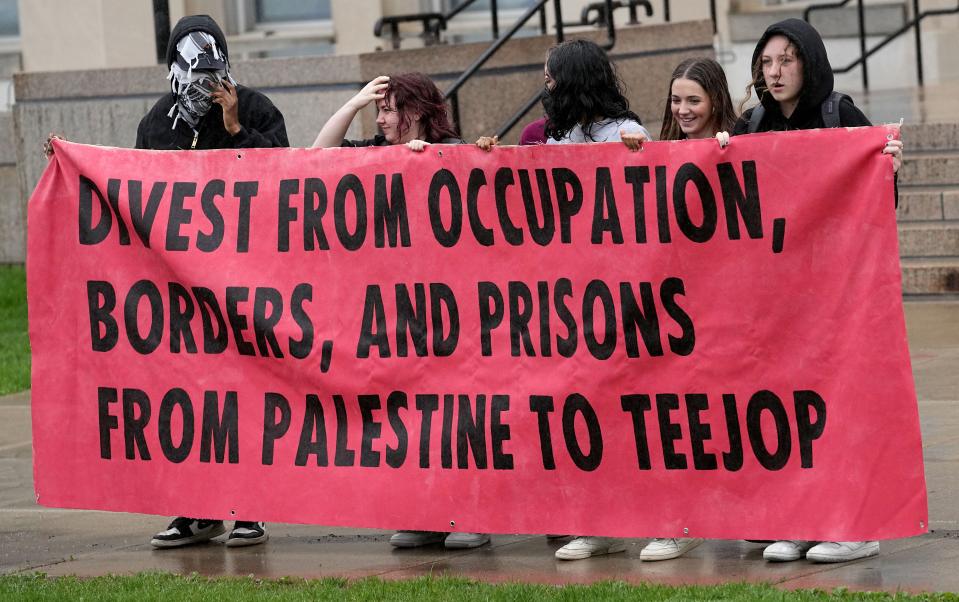 Demonstrators protest the Israel-Hamas war on April 29 at the University of Wisconsin-Madison. Student protesters around the country have demanded colleges cut financial ties to Israel. The latest demonstrations show growing discontent over their schools’ responses to the war in Gaza.