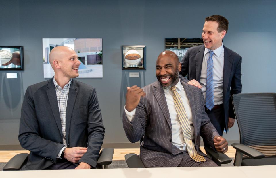 United Wholesale Mortgage chief legal officer Adam Wolfe, left, and leadership coach Mateen Cleaves joke with president and CEO Mat Ishbia in the Breslin Center conference room at United Shore headquarter in Pontiac, Friday, Feb. 28, 2020.