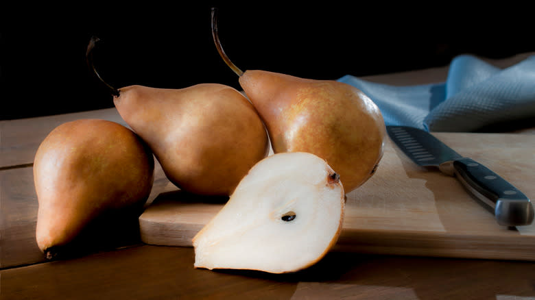 bosc pears with black backdrop sliced