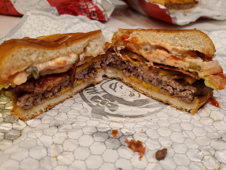 wendys big bacon classic cut open on white wrapper