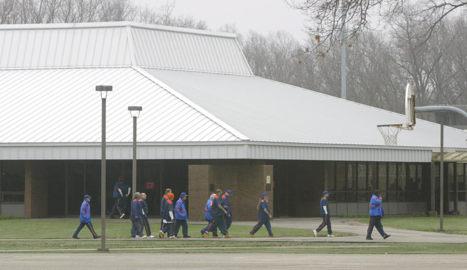 In this April 7, 2010 photo, inmates who were transferred from the Pennsylvania Department of Corrections walk in the yard toward the food service building, in background, at the Muskegon Correctional Facility, in Muskegon, Mich. (Ken Stevens/AP Photo/The Muskegon Chronicle)