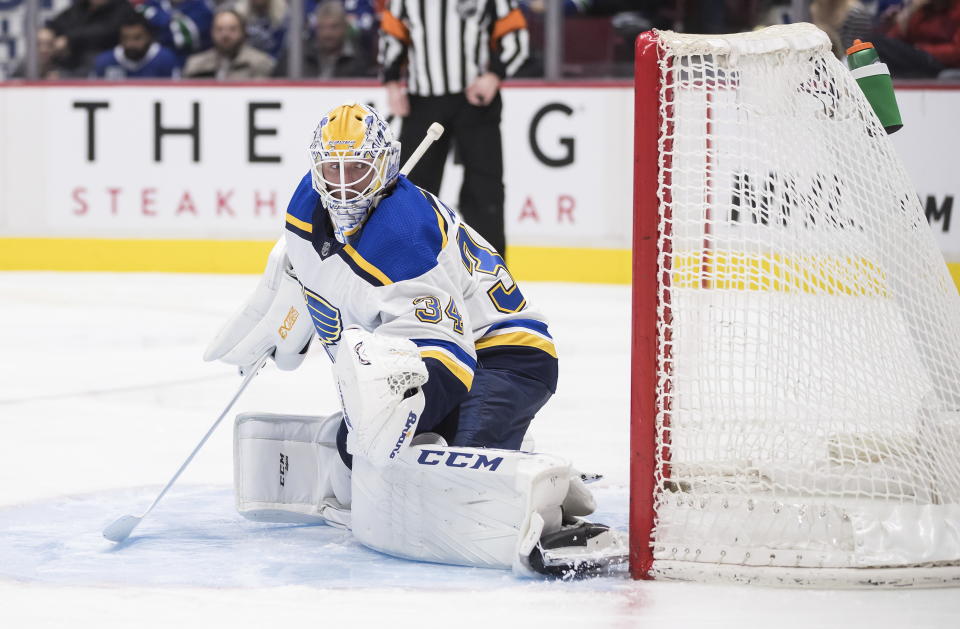 St. Louis Blues goalie Jake Allen allows a goal by Vancouver Canucks' J.T. Miller during the second period of an NHL hockey game in Vancouver, British Columbia on Monday Jan. 27, 2020. (Darryl Dyck/The Canadian Press via AP)