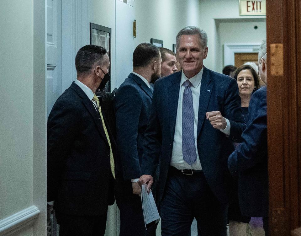 US Speaker of the House Kevin McCarthy, Republican of California, celebrates after meeting with House Minority Leader Hakeem Jeffries, Democrat of New York, on Capitol Hill in Washington, DC, on September 30, 2023. Last-gasp moves to prevent a US government shutdown took a dramatic step forward Saturday, as Democrats overwhelmingly backed an eleventh-hour Republican measure to keep federal funding going for 45 days, albeit with a freeze on aid to Ukraine. The stopgap proposal adopted by the House of Representatives with a vote of 335-91 was pitched by McCarthy. (Photo by ANDREW CABALLERO-REYNOLDS/AFP via Getty Images)