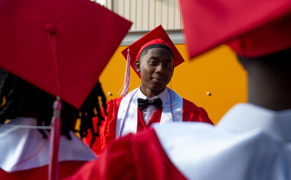 May 17, 2022; Tuscaloosa, AL, USA; Central High School students in the Class of 2022 prepare for their graduation at the Tuscaloosa Amphitheater Tuesday. Jamal Brasfield waits backstage with classmates for the ceremony to begin. Gary Cosby Jr.-The Tuscaloosa News