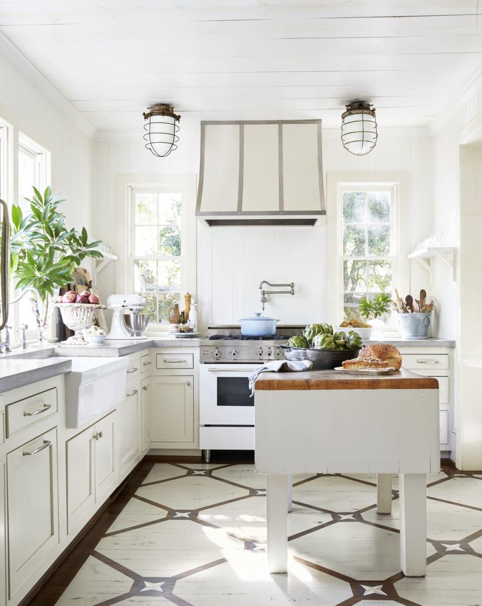 <p>Ahhh finally, an all-white kitchen that we can actually live in! In this 100-year-old home designed by Heather Chadduck Hillegas, the ceiling and walls are painted with <a href="https://www.behr.com/consumer/ColorDetailView/12" rel="nofollow noopener" target="_blank" data-ylk="slk:Swiss Coffee by Behr;elm:context_link;itc:0;sec:content-canvas" class="link ">Swiss Coffee by Behr</a> and the windows are trimmed with <a href="https://go.redirectingat.com?id=74968X1596630&url=https%3A%2F%2Fwww.farrow-ball.com%2Fen-us%2Fpaint-colours%2Fshaded-white&sref=https%3A%2F%2Fwww.popularmechanics.com%2Fhome%2Fg37190959%2Fpaint-colors-small-rooms%2F" rel="nofollow noopener" target="_blank" data-ylk="slk:Shaded White by Farrow & Ball;elm:context_link;itc:0;sec:content-canvas" class="link ">Shaded White by Farrow & Ball</a>.</p>