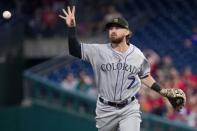 May 17, 2019; Philadelphia, PA, USA; Colorado Rockies second baseman Brendan Rodgers (9) tosses the ball after fielding the final out of the first inning against the Philadelphia Phillies at Citizens Bank Park. Bill Streicher-USA TODAY Sports