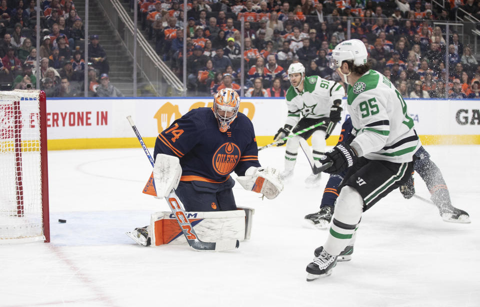 Dallas Stars' Matt Duchene (95) scores on Edmonton Oilers goalie Stuart Skinner (74) during the first period of an NHL hockey game Thursday, Nov. 2, 2023, in Edmonton, Alberta. (Jason Franson/The Canadian Press via AP)